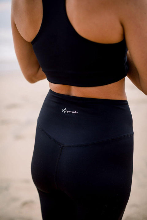 High-waisted sustainable black yoga leggings with Moonah Wear logo