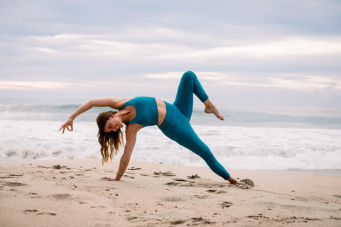 Jonna Monola wearing ocean blue high waist yoga pants and blue yoga top 