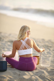 Criss cross white yoga top and purple high waisted yoga leggins Moonah Wear